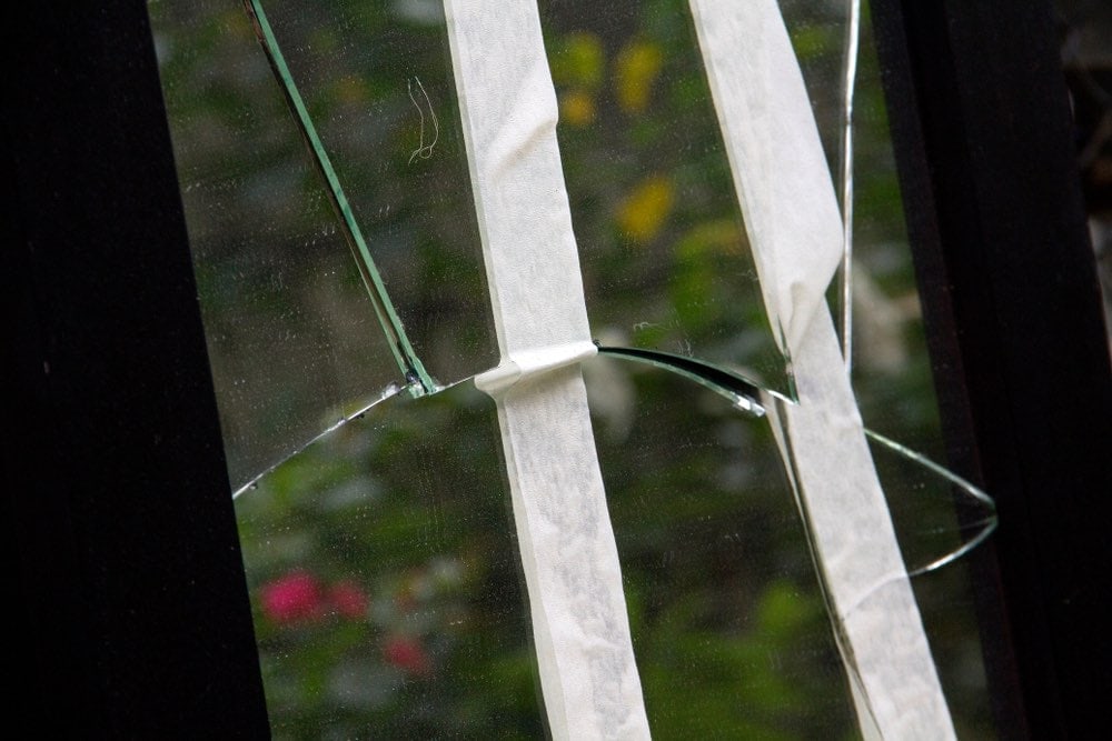 shattered mirror fixed with tape