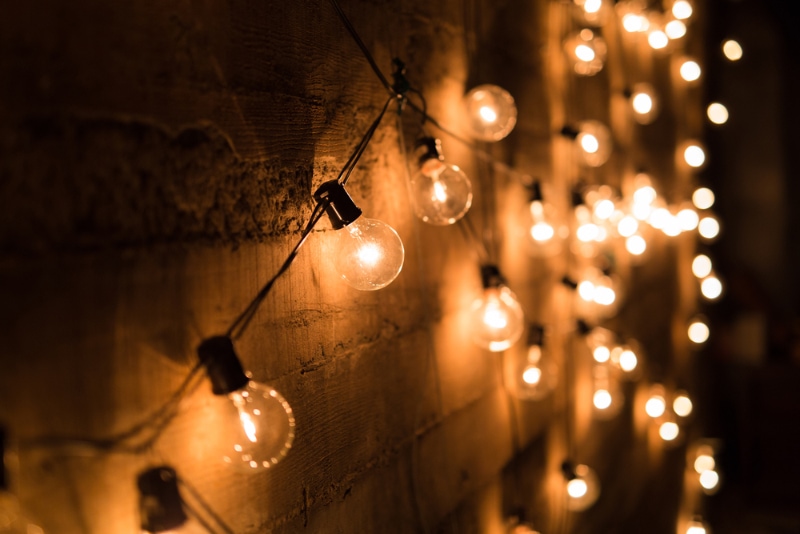 string lights against a concrete wall