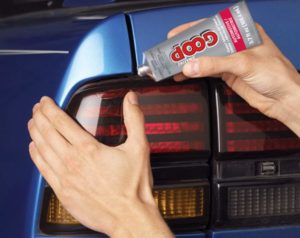 using Amazing GOOP Automotive Adhesive on car