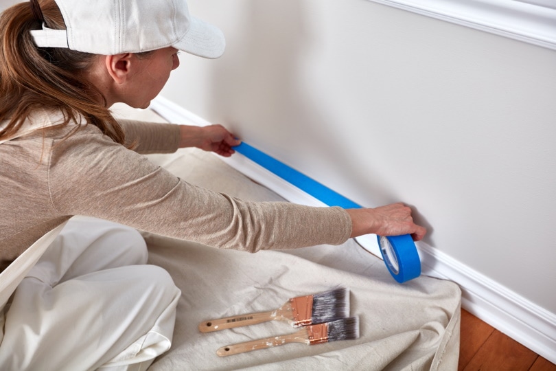 woman painting wall