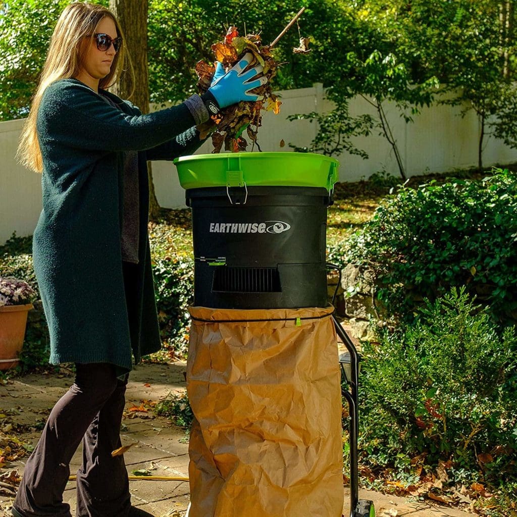woman using Earthwise LM71313 Electric Leaf Mulcher
