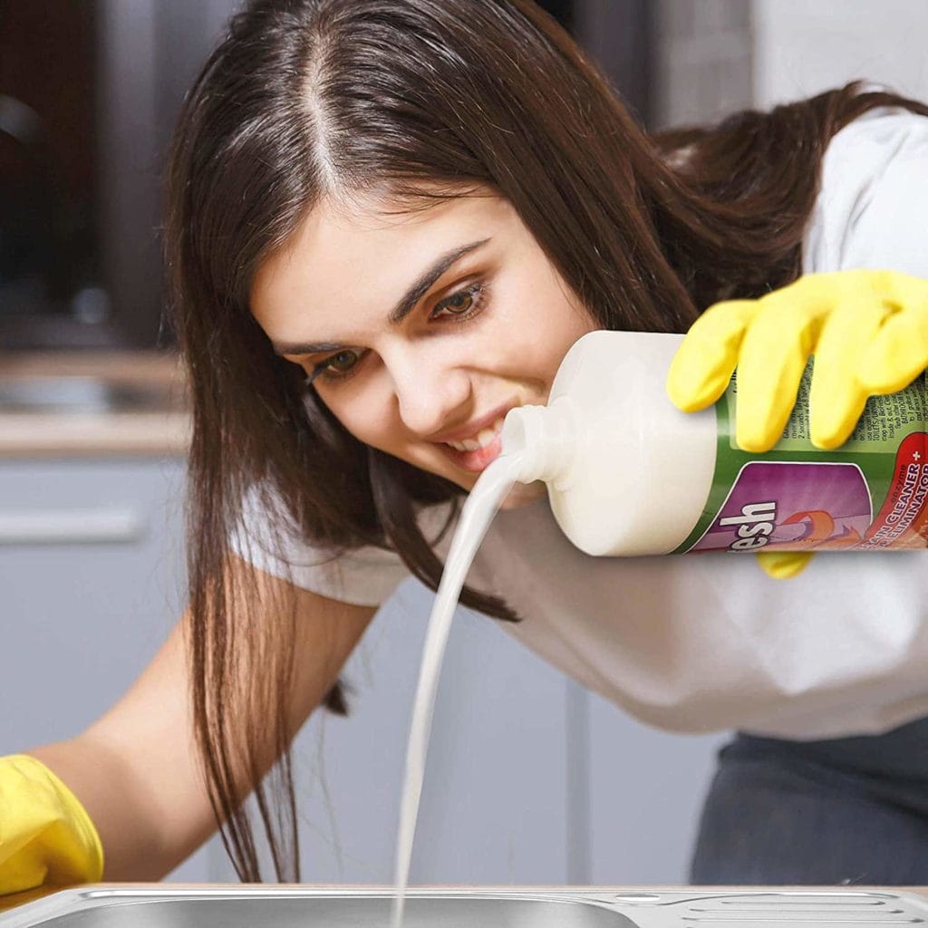 woman using Helix Laboratories BioFresh Enzyme Drain Cleaner
