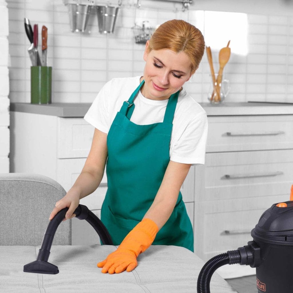 woman using TACKLIFE Wet:Dry Vacuum