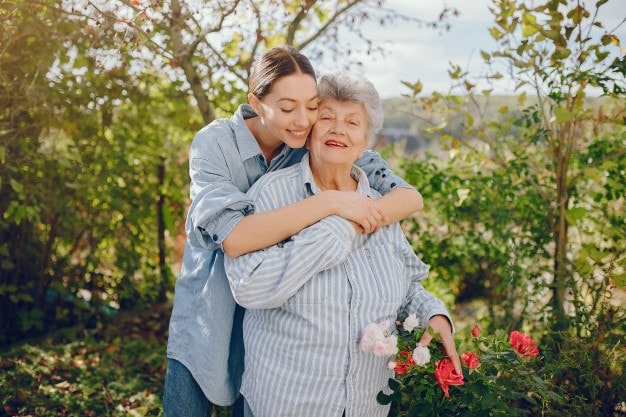 young woman and old woman in the garden