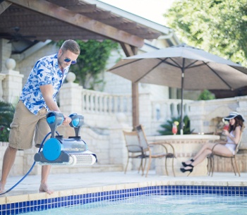 a pool vac being inserted into the pool