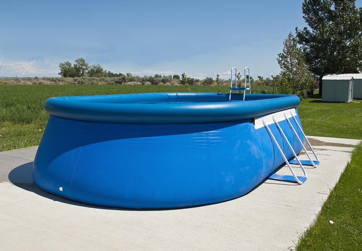 bove ground pool on concrete pad