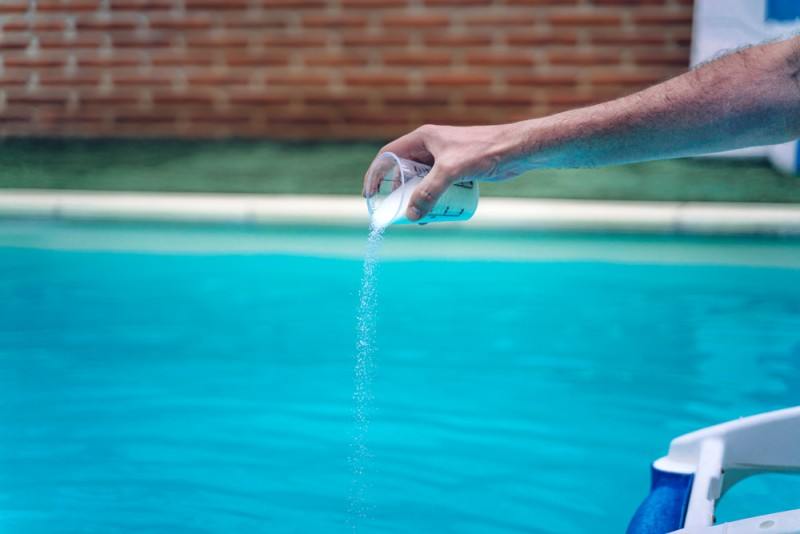 adding chlorine to pool