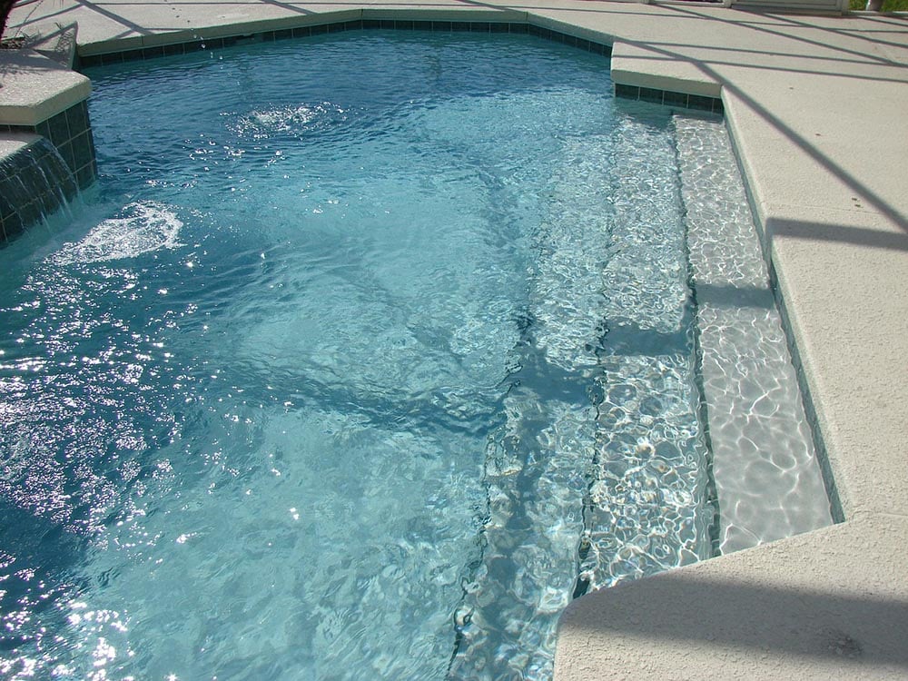 concrete pool with stairs