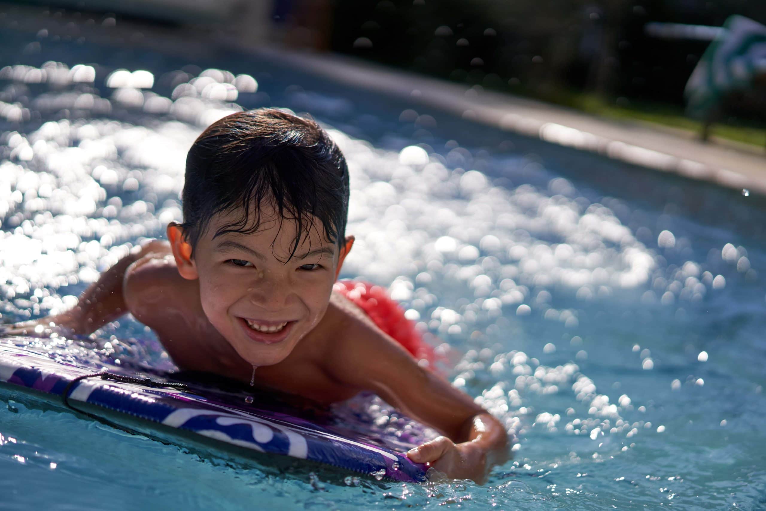 little boy swimming in the pool