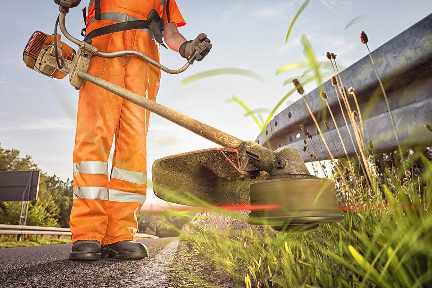 person using a brush cutter