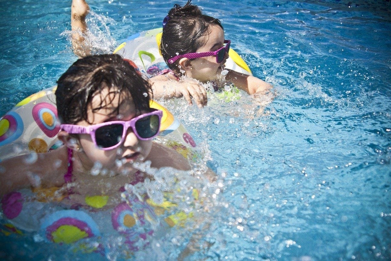 two girls swimming