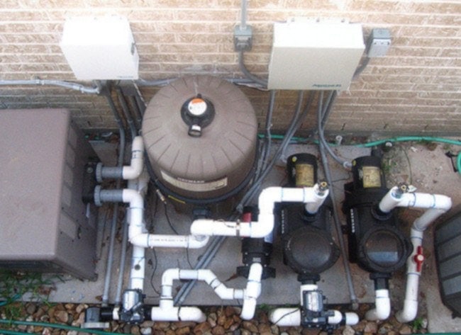 swim pool heater vs heat pump