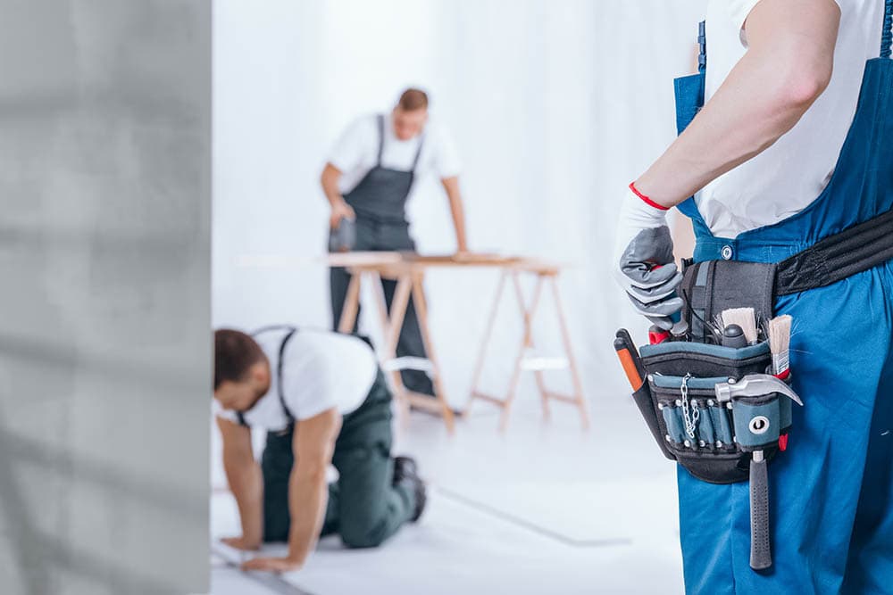 three handymen working