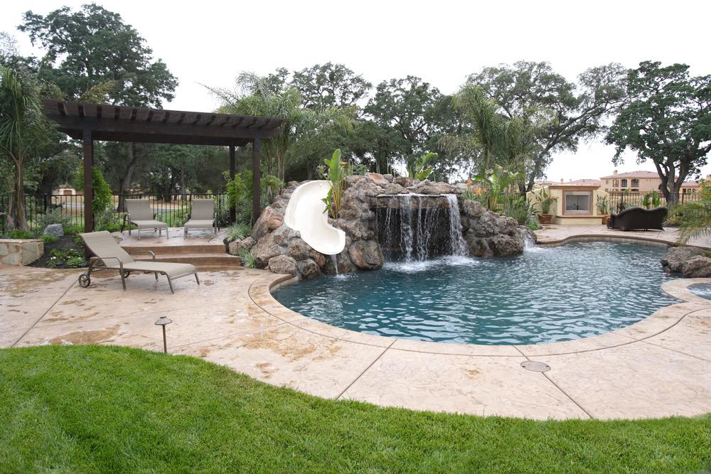 waterslide with water fall into pool