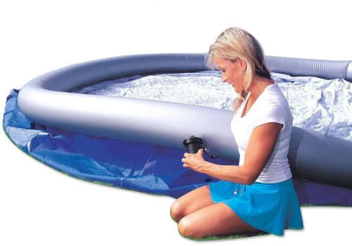woman set up inflatable pool