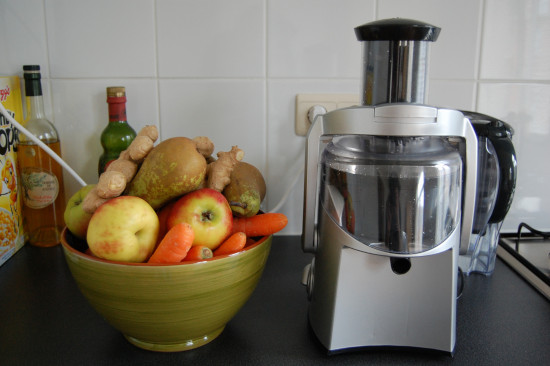 juicer with fruits and vegetables
