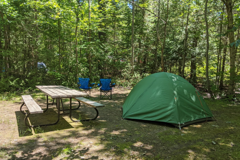 campsite with picnic table and tent