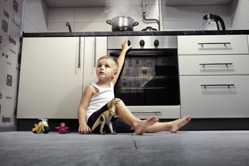 child playing at the kitchen