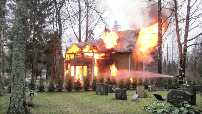 fireman taking down house fire
