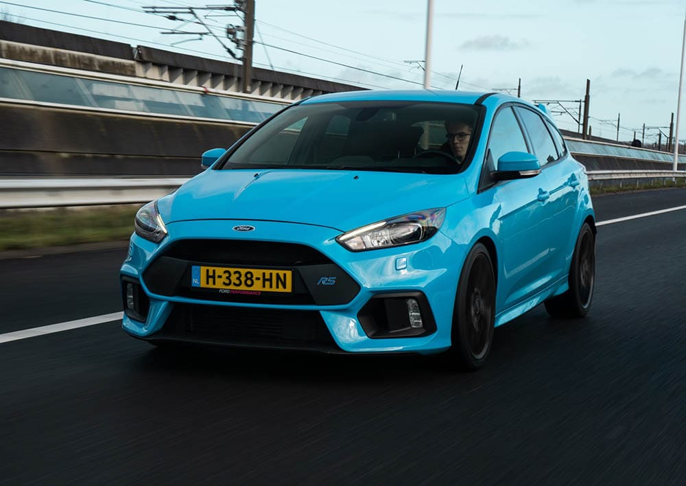 light blue ford sedan
