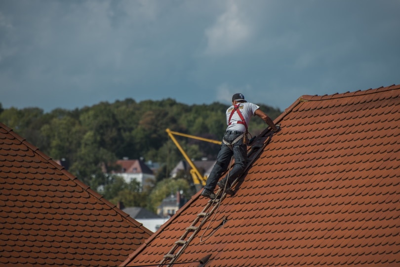 man doing roof repair