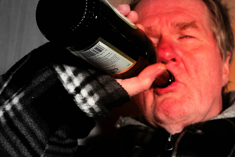man drinking alcohol