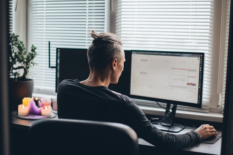 man in front of his computer