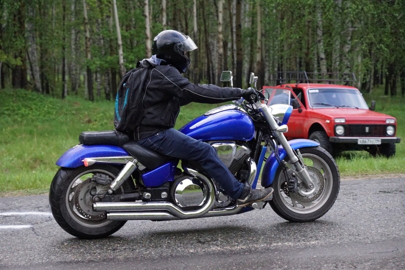 man riding in motorcycle