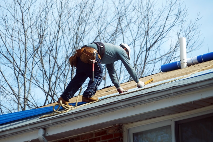 man working on the roof