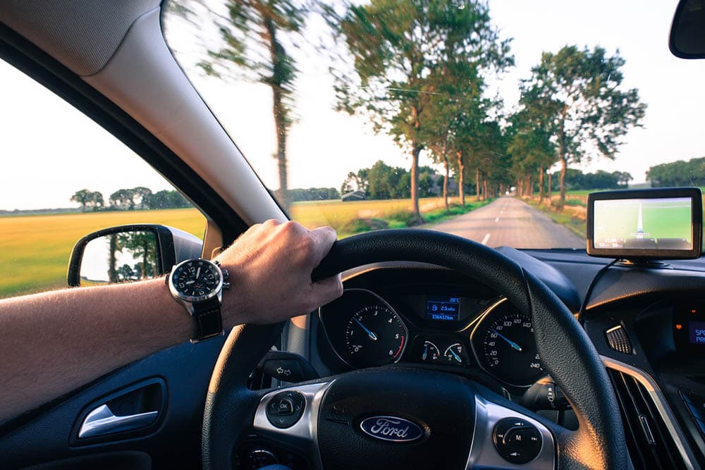 person driving a Ford vehicle