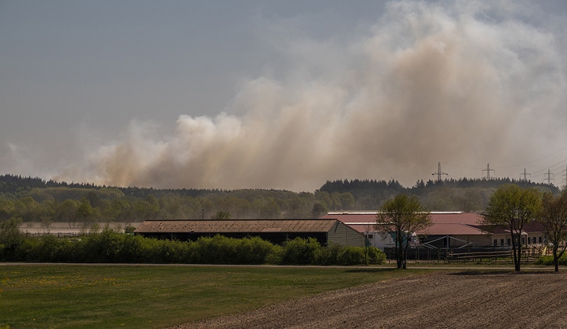 smoke can be seen few miles from barn farm