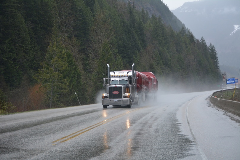 truck travelling on wet road