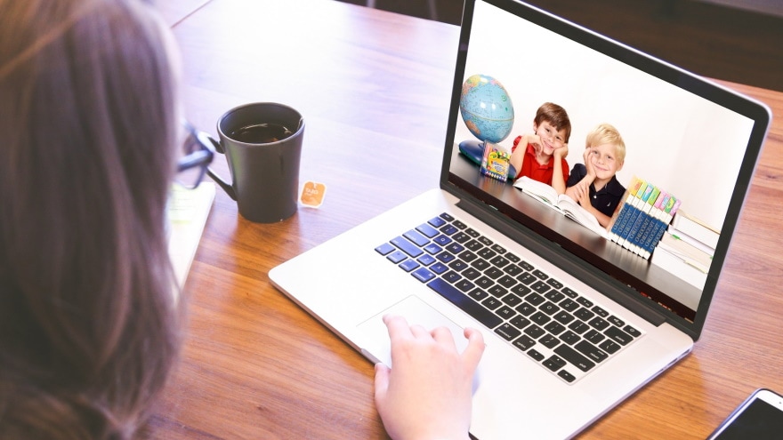 woman having video call with kids