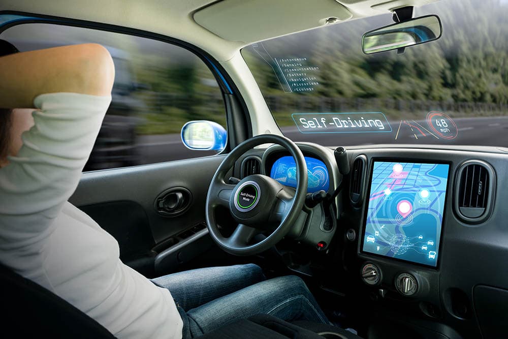 woman in a self driving car