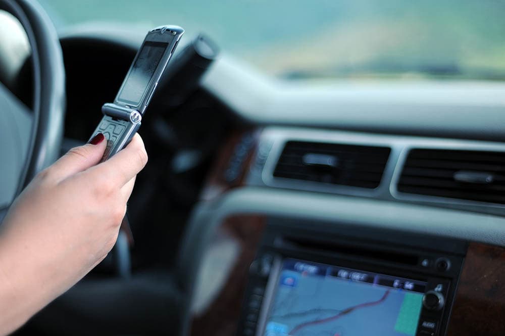 woman texting while driving