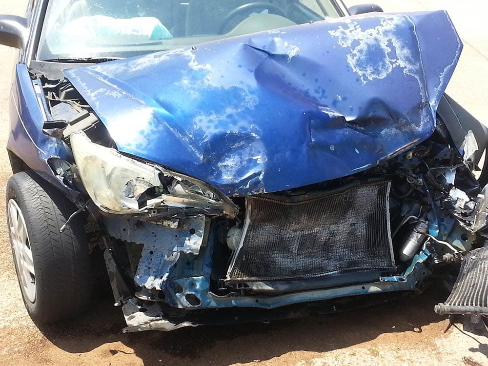 wrecked blue car