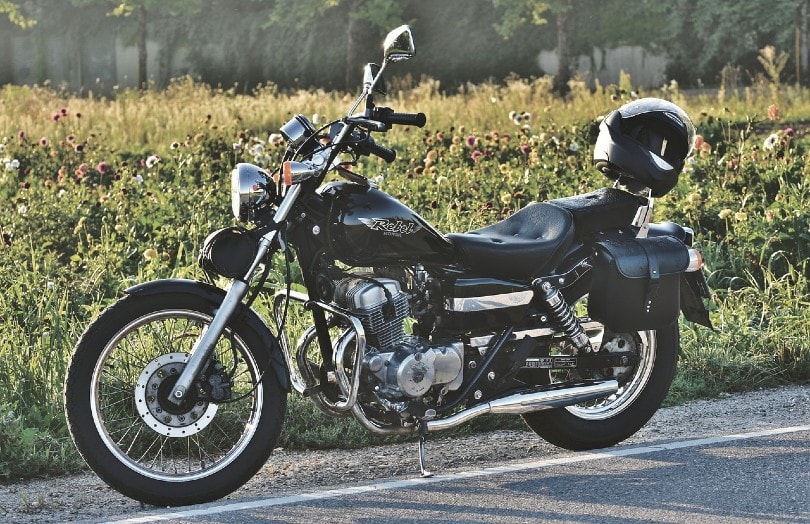 black honda motorcycle parked on the side of the road