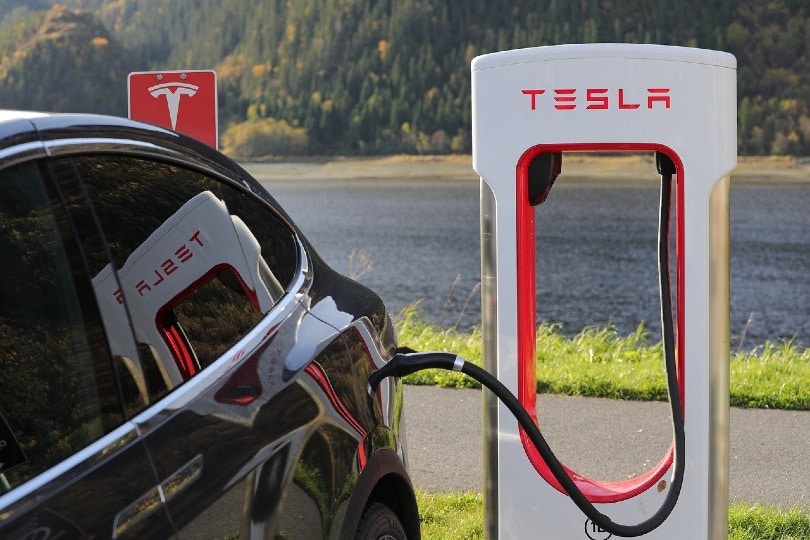 electric car being charged by tesla power system