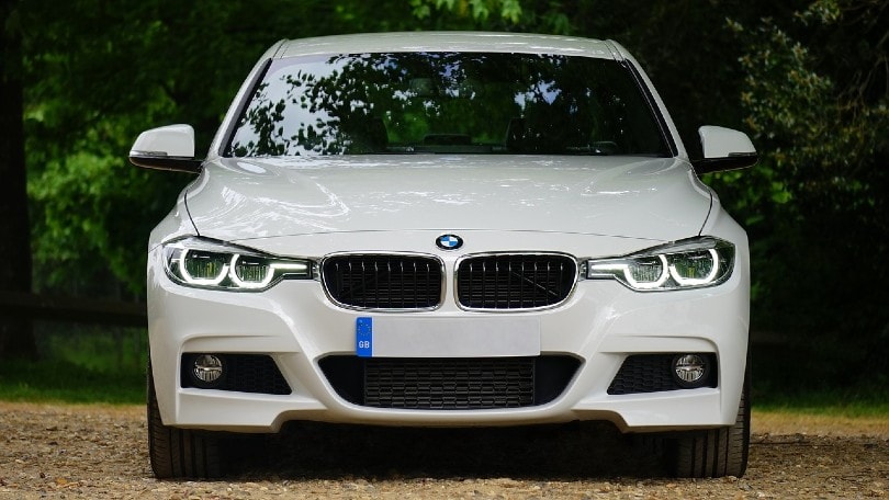 front view of a parked white bmw car