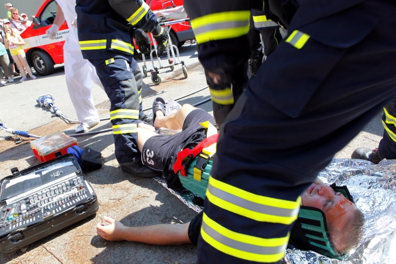 medic helping injured man