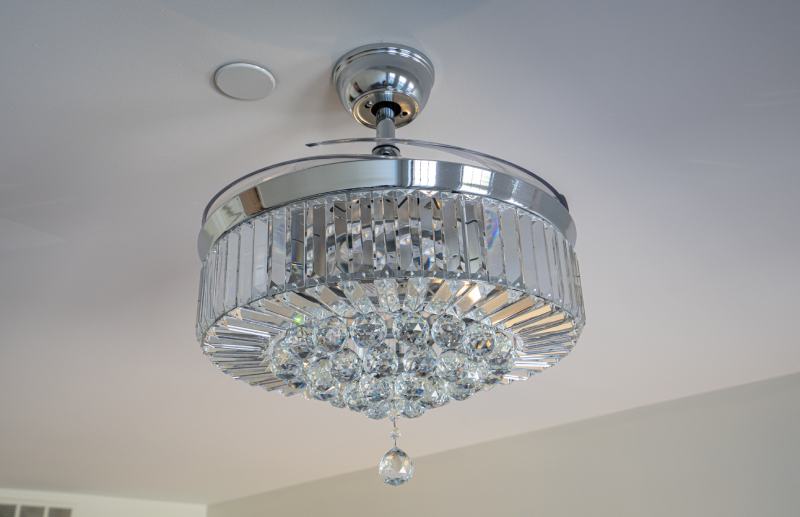 modern style chandelier is also a ceiling fan with hidden blades