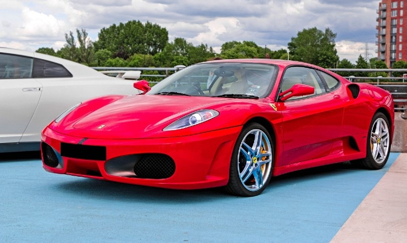 red ferrari in the parking lot