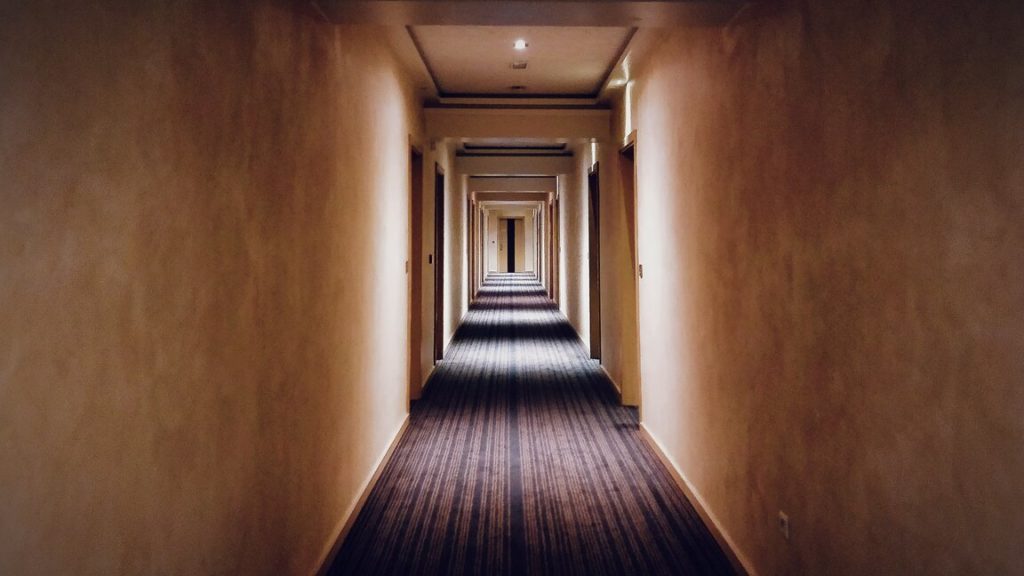 long hallway with wallpaper