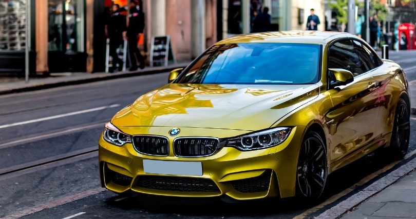 shiny bmw car parked on the side of the road