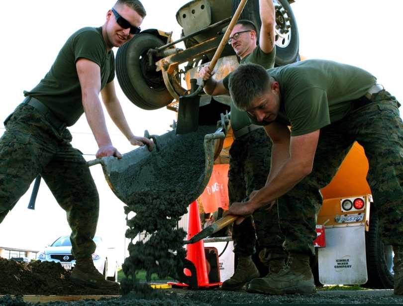 soldiers mixing cement