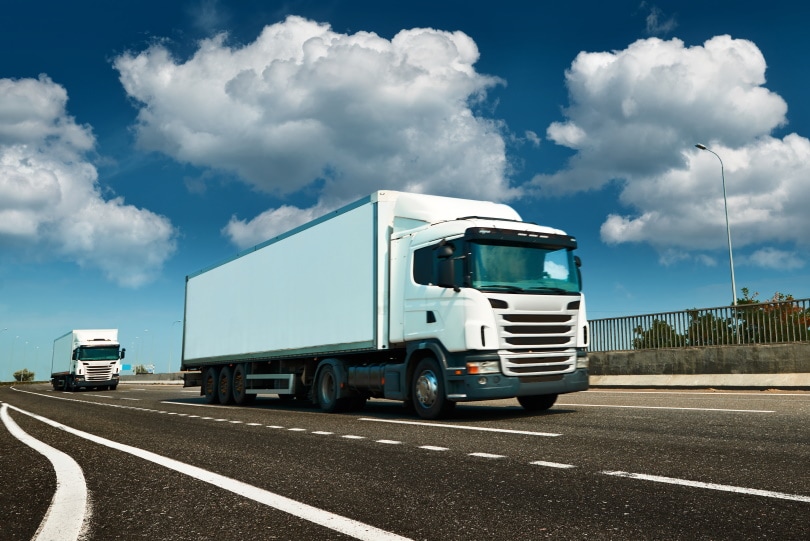 trucks travelling on the road