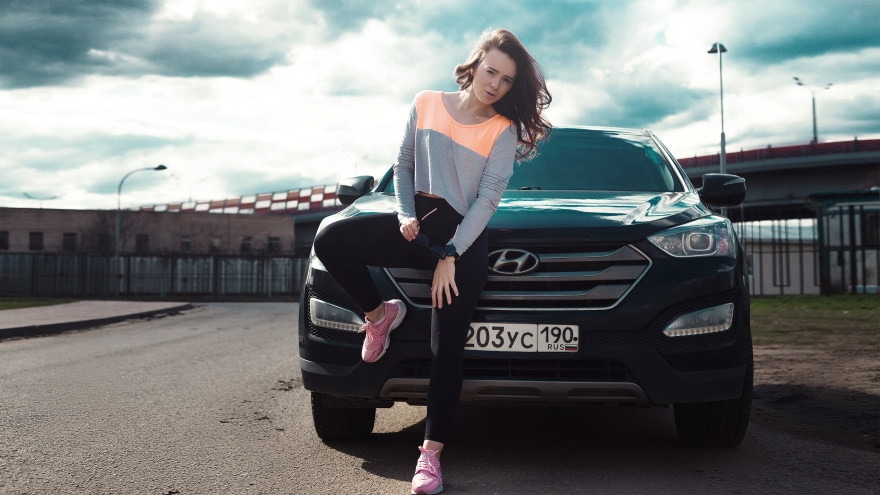 woman infront of hyundai car