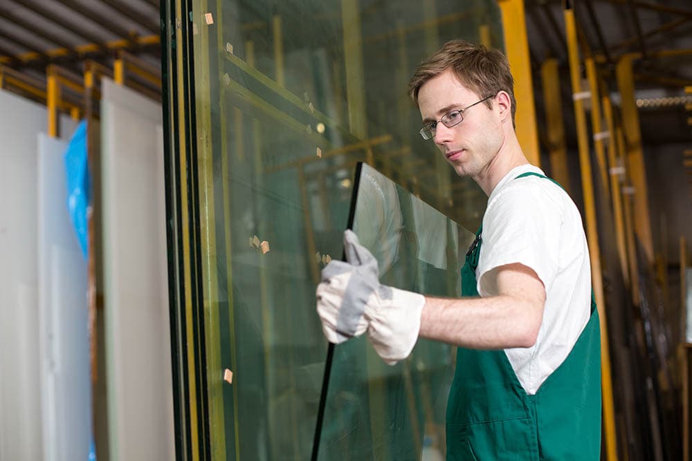 worker handling a glass