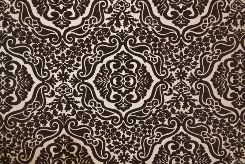 a dark brown flock wallpaper pattern