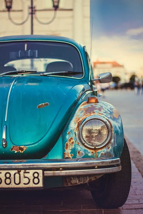 blue car getting rusty